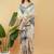 Off white polyester printed saree with blouse