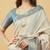 Off white polyester printed saree with blouse
