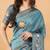 Teal polyester woven design saree with blouse