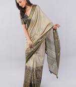 Cream polyester woven design saree with blouse