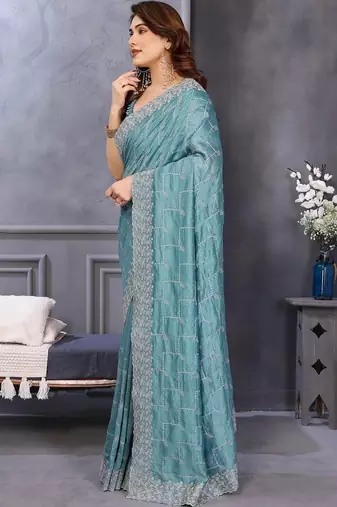 Teal silk blend embroidered saree with blouse