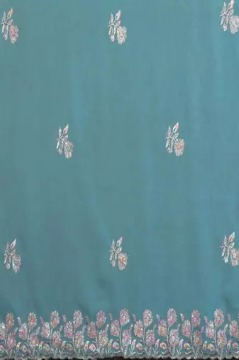 Turquoise pure georgette embroidered saree with blouse