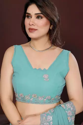 Turquoise pure georgette embroidered saree with blouse