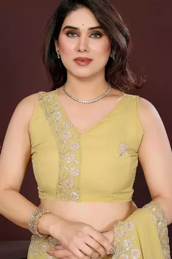 Yellow pure georgette embroidered saree with blouse
