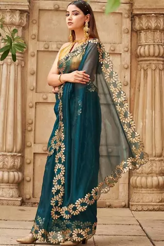 Teal net embroidered saree with blouse