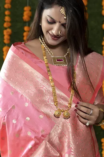 Baby pink woven banarasi silk blend saree with blouse