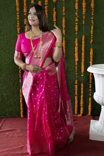 Rani pink woven banarasi silk blend saree with blouse