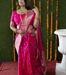 Rani pink woven banarasi silk blend saree with blouse