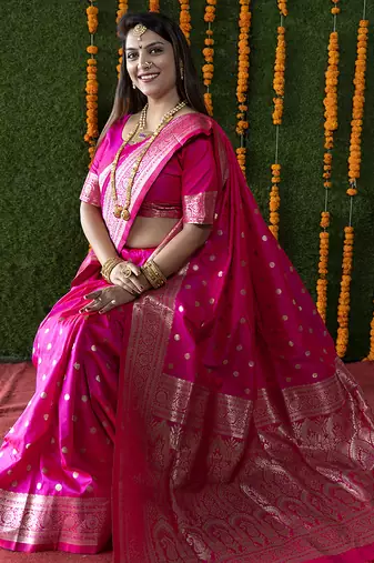 Rani pink woven banarasi silk blend saree with blouse