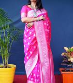 Rani pink woven banarasi silk blend saree with blouse