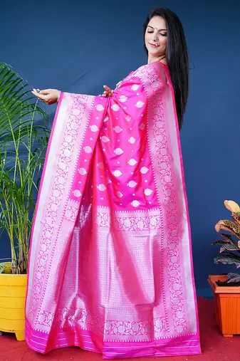 Rani pink woven banarasi silk blend saree with blouse