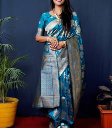 Teal blue woven banarasi silk blend saree with blouse