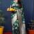 Dark green woven banarasi silk blend saree with blouse