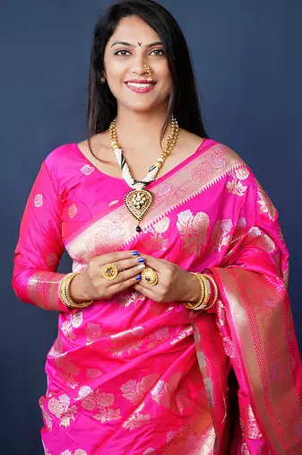 Rani pink woven banarasi silk blend saree with blouse