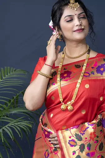 Red zari woven paithani silk blend saree with blouse