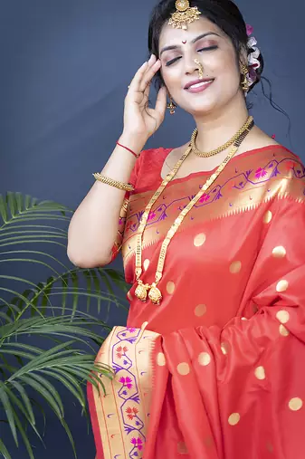 Red zari woven paithani silk blend saree with blouse