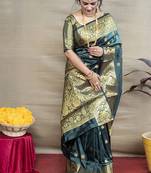 Deep teal green banarasi silk blend saree with golden zari work