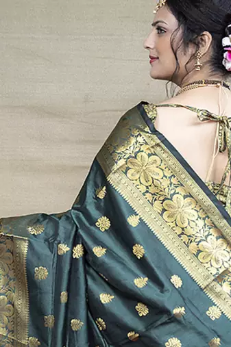 Deep teal green banarasi silk blend saree with golden zari work