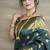 Deep teal green banarasi silk blend saree with golden zari work
