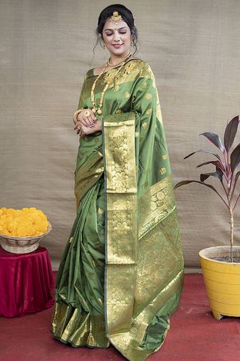 Green banarasi silk blend saree with golden zari work