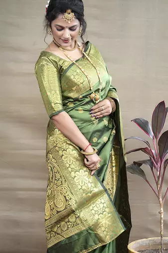 Green banarasi silk blend saree with golden zari work
