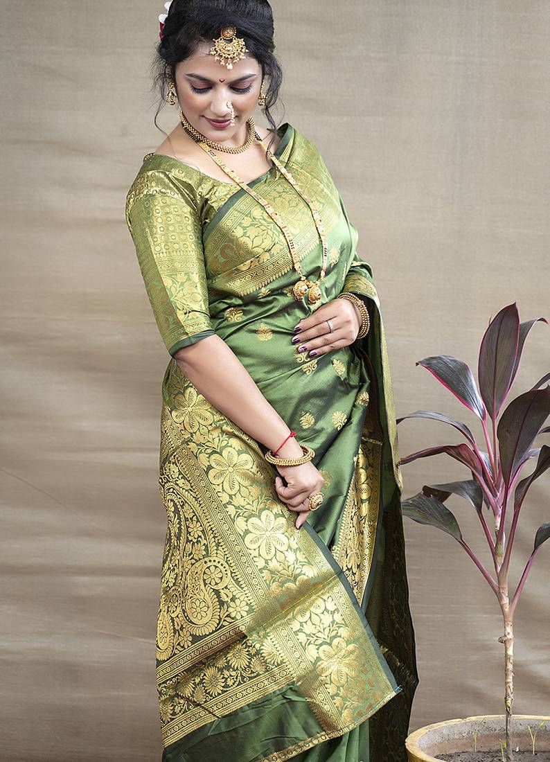 Green banarasi silk blend saree with golden zari work