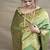 Green banarasi silk blend saree with golden zari work
