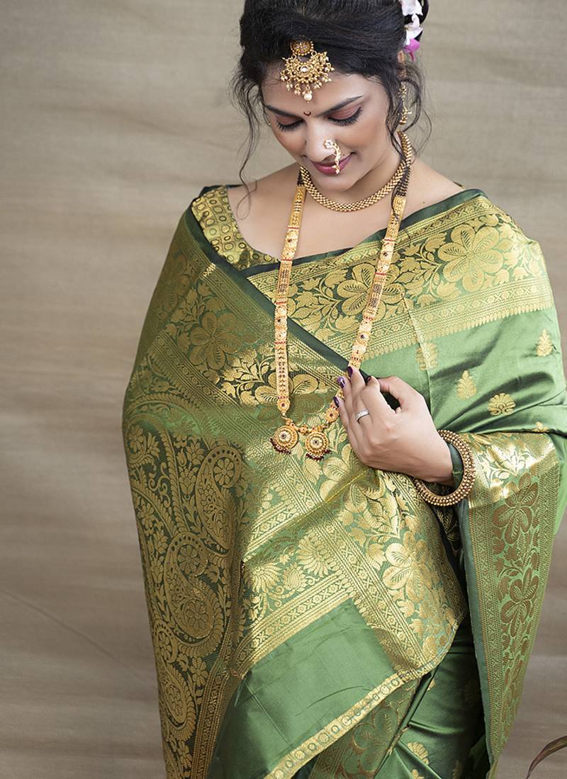 Green banarasi silk blend saree with golden zari work