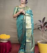 Turquoise banarasi silk blend saree with golden zari work