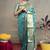Turquoise banarasi silk blend saree with golden zari work