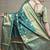 Turquoise banarasi silk blend saree with golden zari work