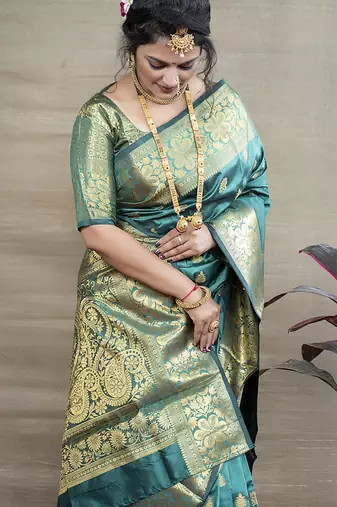 Turquoise banarasi silk blend saree with golden zari work