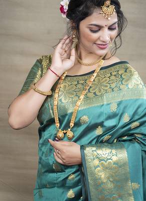 Turquoise banarasi silk blend saree with golden zari work 4