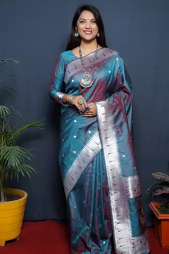 Teal blue paithani silk blend saree with silver zari border