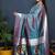 Teal blue paithani silk blend saree with silver zari border