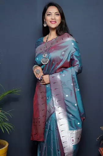 Teal blue paithani silk blend saree with silver zari border