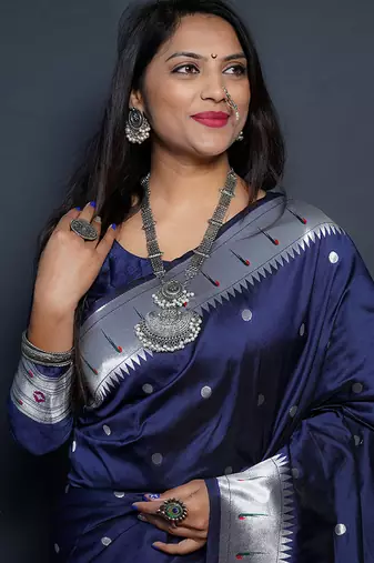 Navy blue paithani silk blend saree with silver zari border