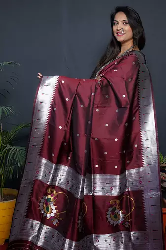 Maroon paithani silk blend saree with silver zari border