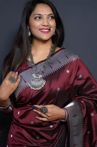 Maroon paithani silk blend saree with silver zari border