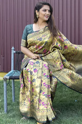 Beige and dark green paithani silk blend saree with peacock motif