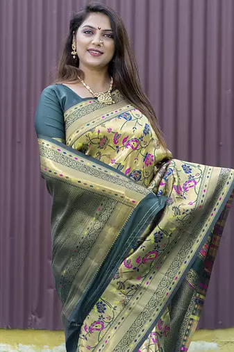 Beige and dark green paithani silk blend saree with peacock motif