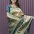 Beige and dark green paithani silk blend saree with peacock motif