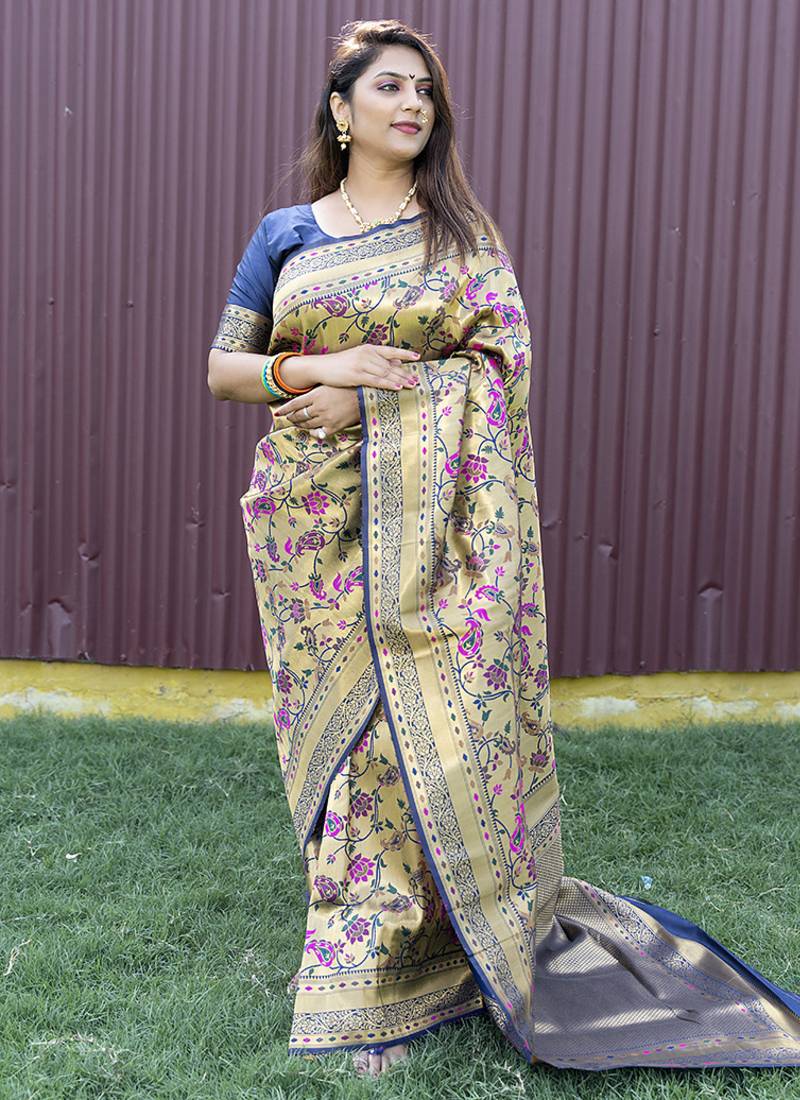 Beige and navy bkue paithani silk blend saree with peacock motif