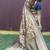 Beige and navy bkue paithani silk blend saree with peacock motif