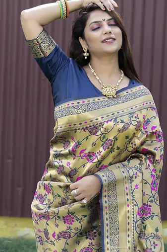 Beige and navy bkue paithani silk blend saree with peacock motif