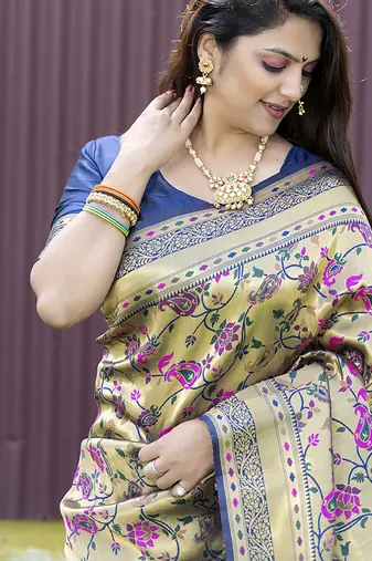 Beige and navy bkue paithani silk blend saree with peacock motif