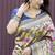 Beige and navy bkue paithani silk blend saree with peacock motif