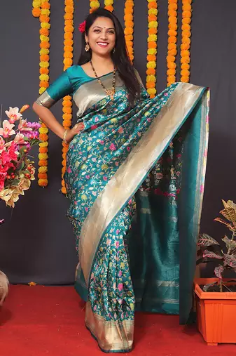 Teal blue banarasi silk blend saree with floral jaal & zari border