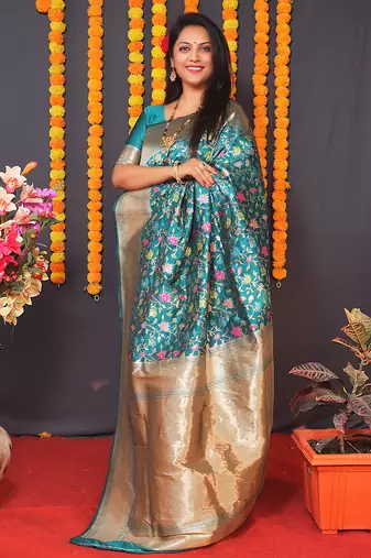 Teal blue banarasi silk blend saree with floral jaal & zari border