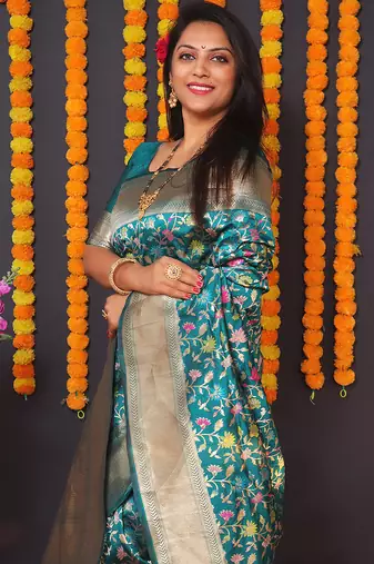 Teal blue banarasi silk blend saree with floral jaal & zari border